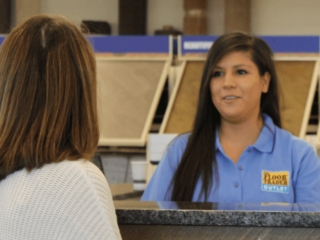 salesperson in flooring store with customer